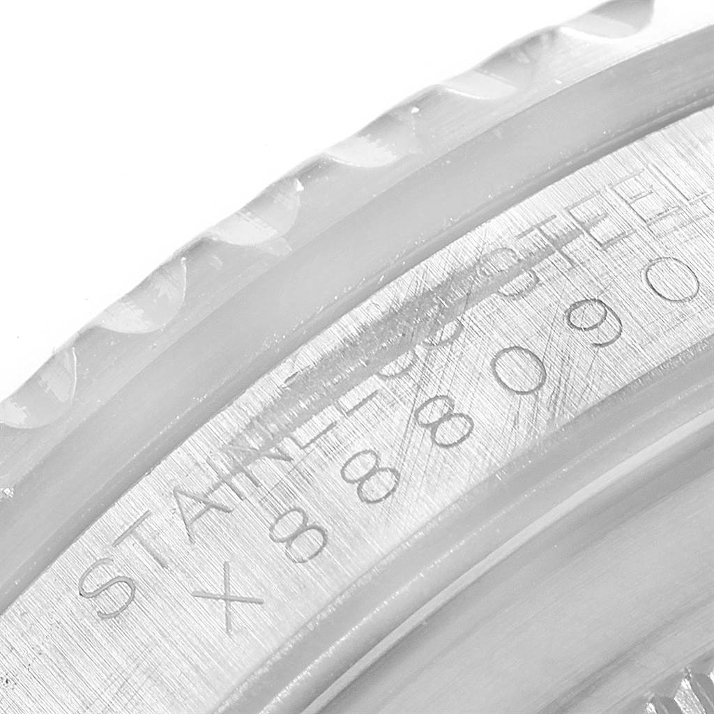 This image shows a close-up of the engraved inner bezel and case of a Rolex GMT-Master 16700 Men's Stainless Steel Black Dial 16700 Men's Stainless Steel Black Dial watch.