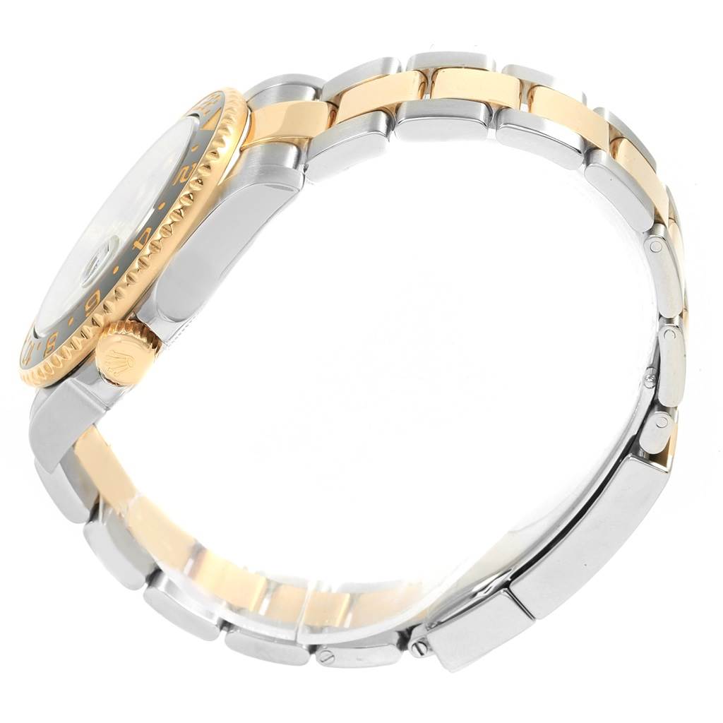 This is a side view of the Rolex GMT-Master 116713 Men's Stainless Steel Black Dial 116713 Men's Stainless Steel Black Dial watch showcasing its bracelet, bezel, and crown.