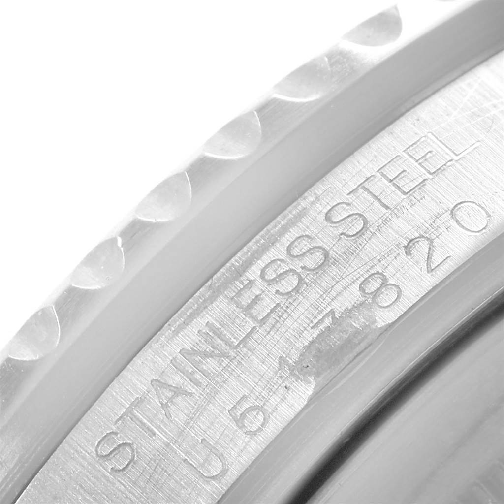 This image shows a close-up of the engraved bezel and inner case of a Rolex GMT-Master 16710 Men's Stainless Steel Black Dial 16710 Men's Stainless Steel Black Dial watch.