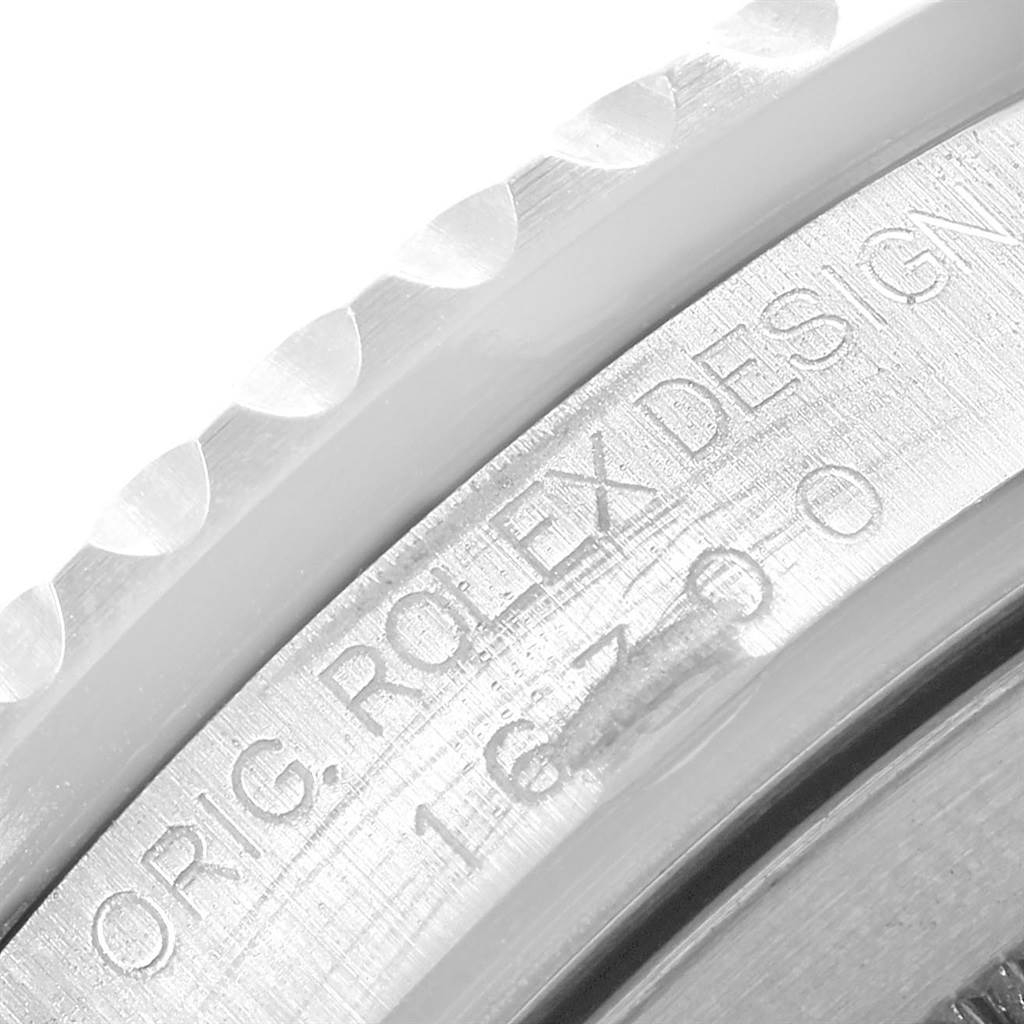This close-up image shows the engraved side of the case of a Rolex GMT-Master 16710 Men's Stainless Steel Black Dial 16710 Men's Stainless Steel Black Dial watch, highlighting the model and brand details.