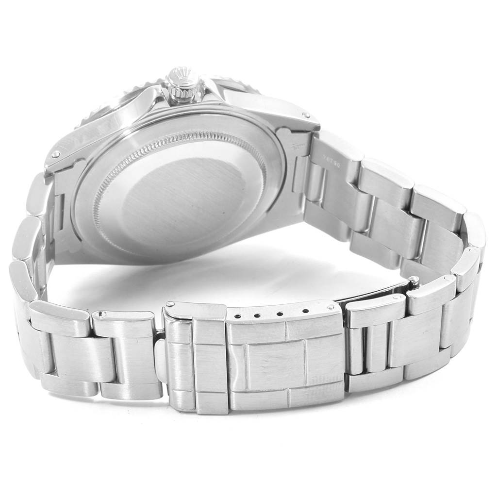 This image shows the back case, crown, and part of the bracelet of the Rolex GMT-Master 16710 Men's Stainless Steel Black Dial 16710 Men's Stainless Steel Black Dial watch.