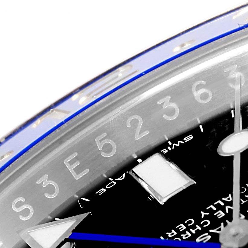 The image shows a close-up of the bezel and part of the dial of the Rolex GMT-Master 116710 Men's Stainless Steel Black Dial 116710 Men's Stainless Steel Black Dial watch, highlighting the 24-hour markers and a hand.