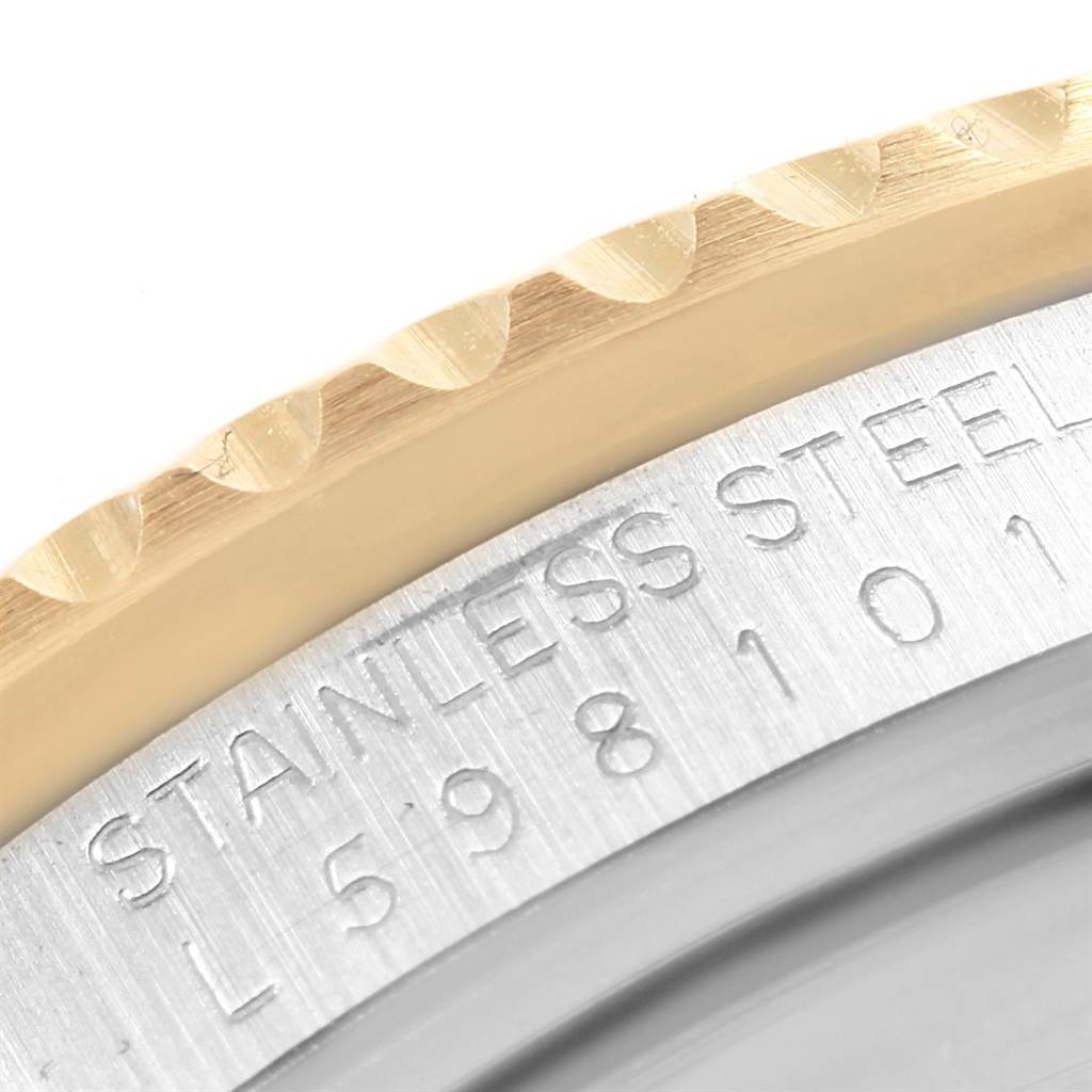 The image shows a close-up of the stainless steel case and gold bezel of a Rolex GMT-Master 16713 Men's Stainless Steel Black Dial 16713 Men's Stainless Steel Black Dial watch.