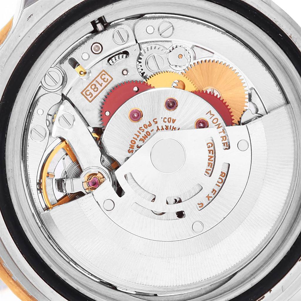 This image shows the intricate internal mechanism of a Rolex GMT-Master 16713 Men's Stainless Steel Black Dial 16713 Men's Stainless Steel Black Dial watch from a close-up, case-back removed angle.