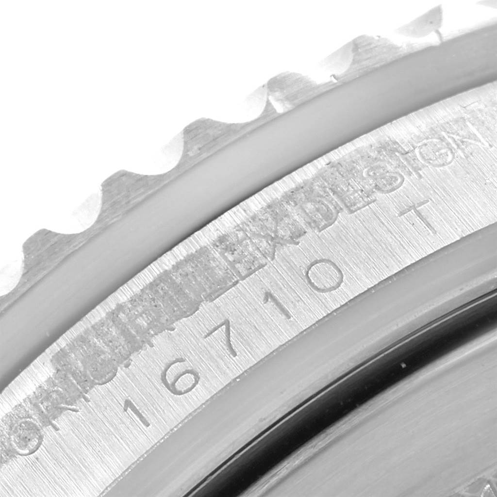 Shown is a close-up of the case side, bezel, and engraved serial number of a Rolex GMT-Master 16710 Men's Stainless Steel Black Dial 16710 Men's Stainless Steel Black Dial watch.
