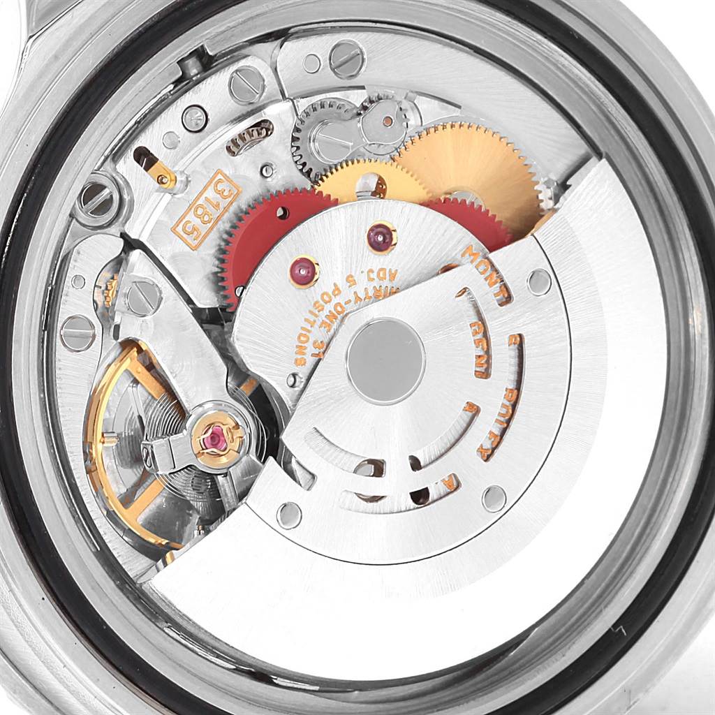 The image shows an interior view of a Rolex GMT-Master 16710 Men
s Stainless Steel Black Dial 16710 Men
s Stainless Steel Black Dial watch, highlighting its movement and intricate components.