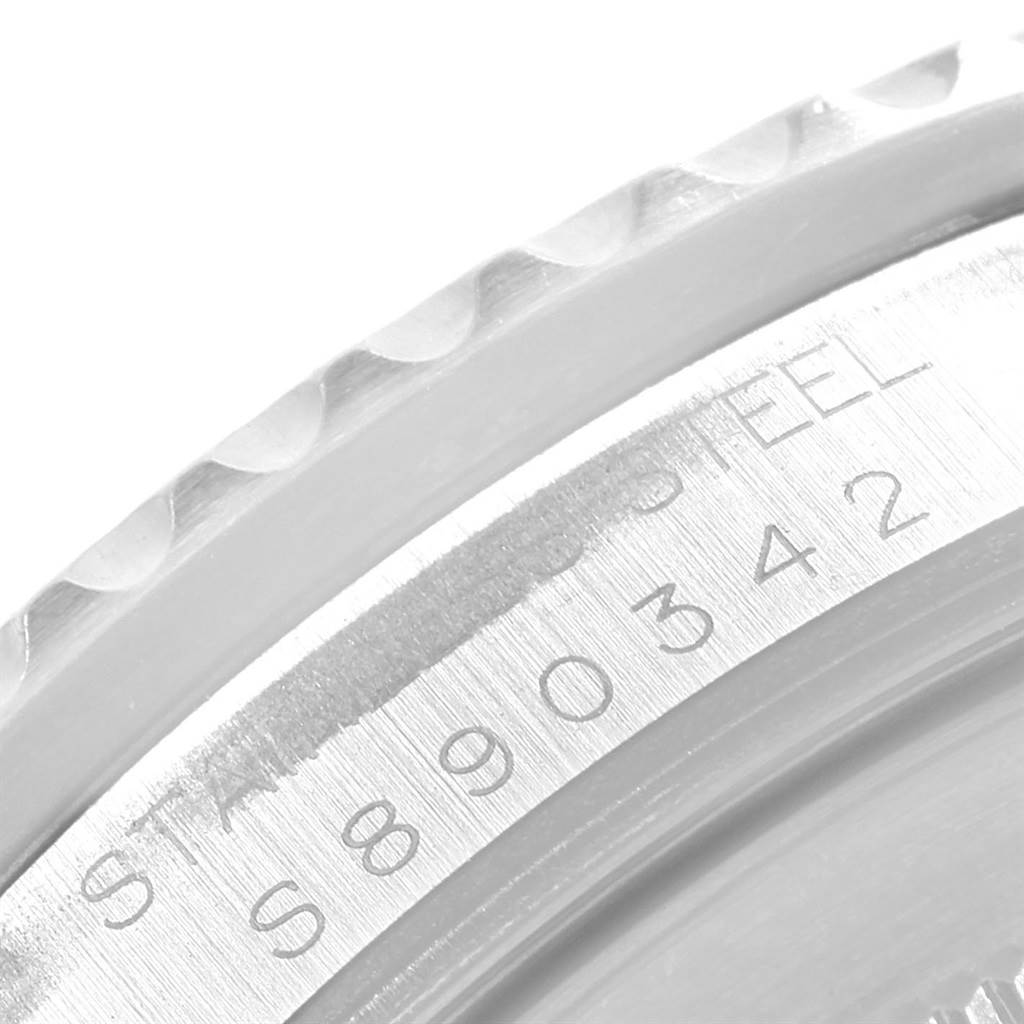 This close-up image shows the engraved serial number and bezel of the Rolex GMT-Master 16710 Men
s Stainless Steel Black Dial 16710 Men
s Stainless Steel Black Dial watch.