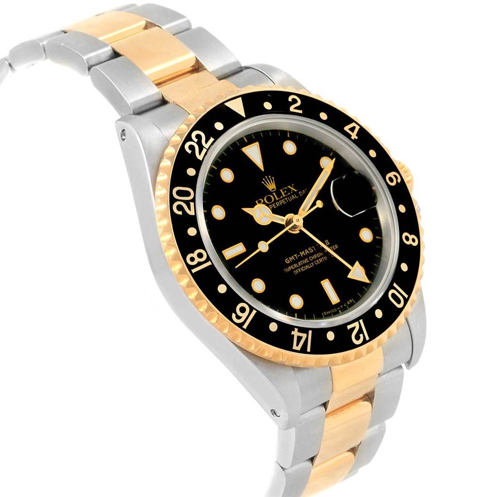 The Rolex GMT-Master 16713 Men's Stainless Steel Black Dial 16713 Men's Stainless Steel Black Dial watch is shown from an angled view, highlighting its two-tone bracelet, black dial, and black bezel.