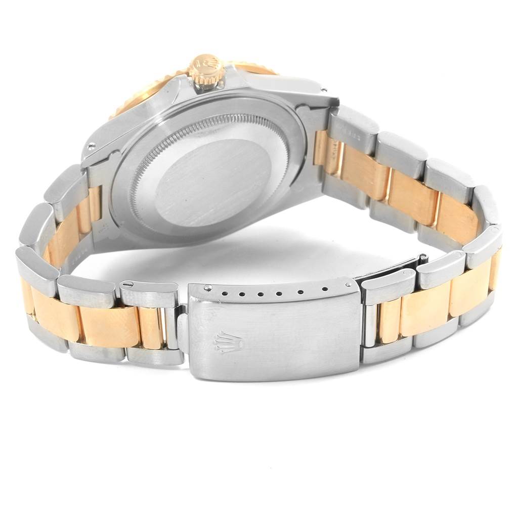 The Rolex GMT-Master 16713 Men's Stainless Steel Black Dial 16713 Men's Stainless Steel Black Dial watch is shown from the rear, displaying the case back and the two-tone bracelet with a clasp.