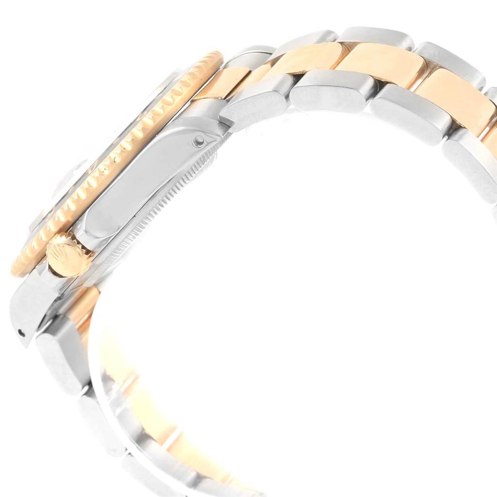 The image shows the side view of a Rolex GMT-Master 16713 Men's Stainless Steel Black Dial 16713 Men's Stainless Steel Black Dial's bezel, crown, and part of the metal bracelet.