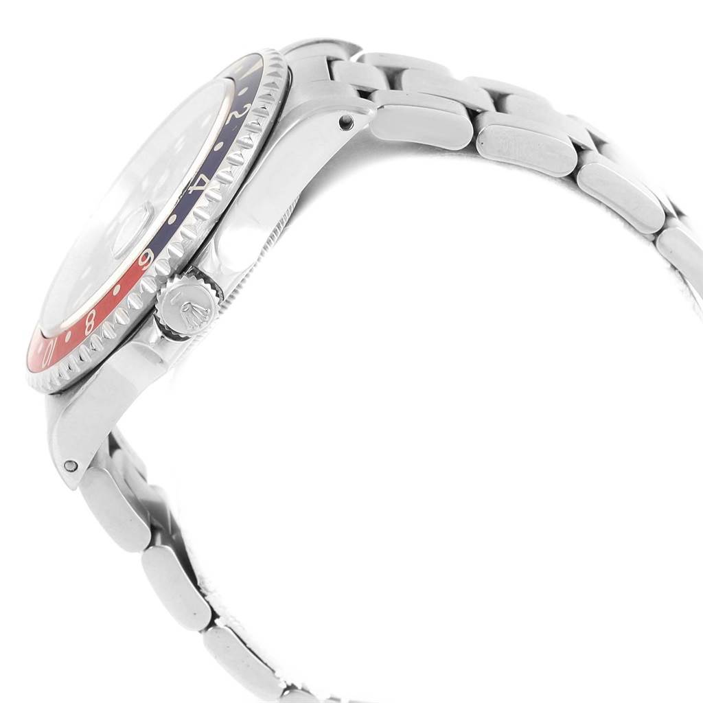 The image shows a side view of a Rolex GMT-Master 16700 Men's Stainless Steel Black Dial 16700 Men's Stainless Steel Black Dial watch, highlighting the bezel, crown, and bracelet.