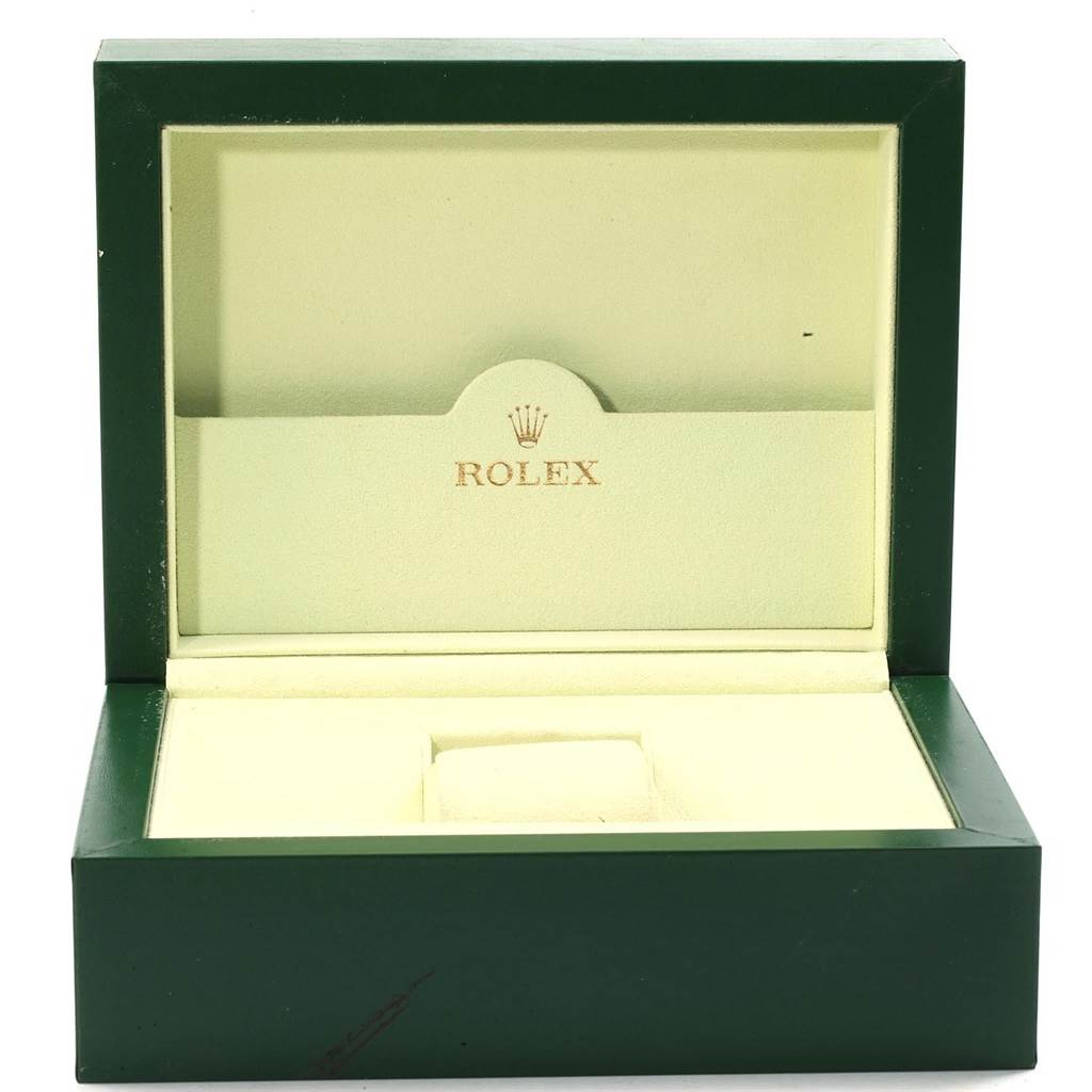 This image shows an open green and beige Rolex watch box, likely for a GMT-Master model.