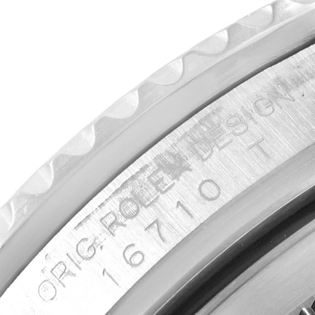 This image shows a close-up of the engraved model number and design details on the case of a Rolex GMT-Master 16710 Men's Stainless Steel Black Dial 16710 Men's Stainless Steel Black Dial watch.