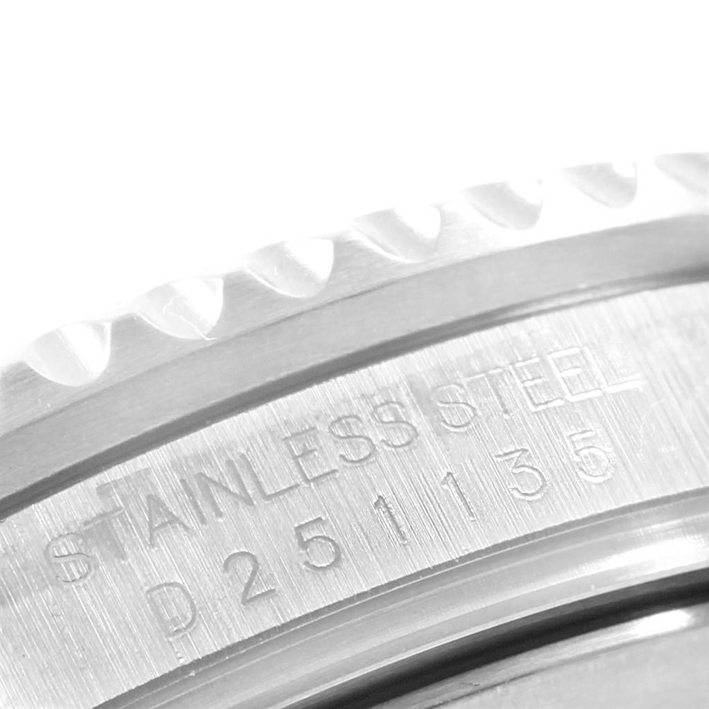 The image shows a close-up of the stainless steel casing with engravings on a Rolex GMT-Master 16710 Men's Stainless Steel Black Dial 16710 Men's Stainless Steel Black Dial watch.