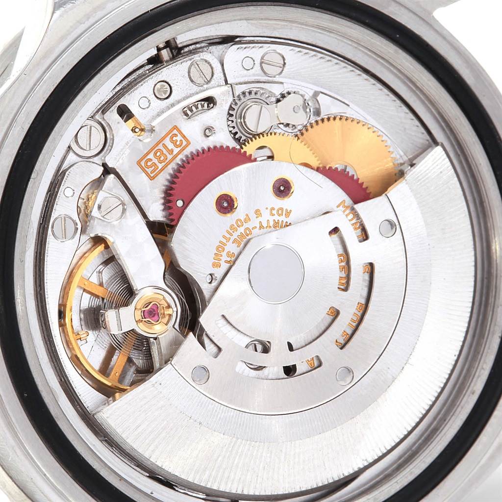 This image shows the movement mechanism of a Rolex GMT-Master 16710 Men's Stainless Steel Black Dial 16710 Men's Stainless Steel Black Dial watch, prominently featuring gears and the rotor.