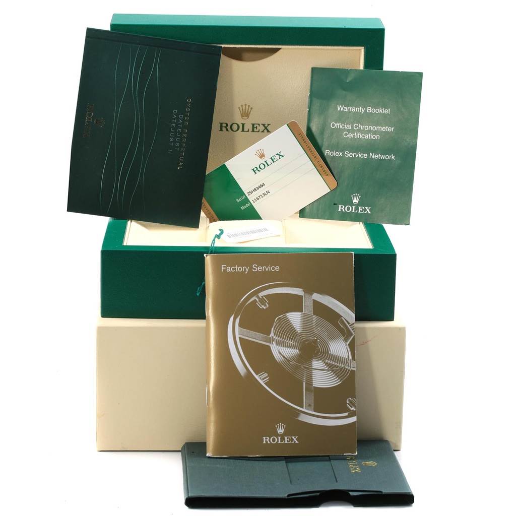 The image shows the Rolex GMT-Master 116713 Men's Stainless Steel Black Dial 116713 Men's Stainless Steel Black Dial's packaging and accessories, including booklets, warranty card, and boxes, from a front angle.