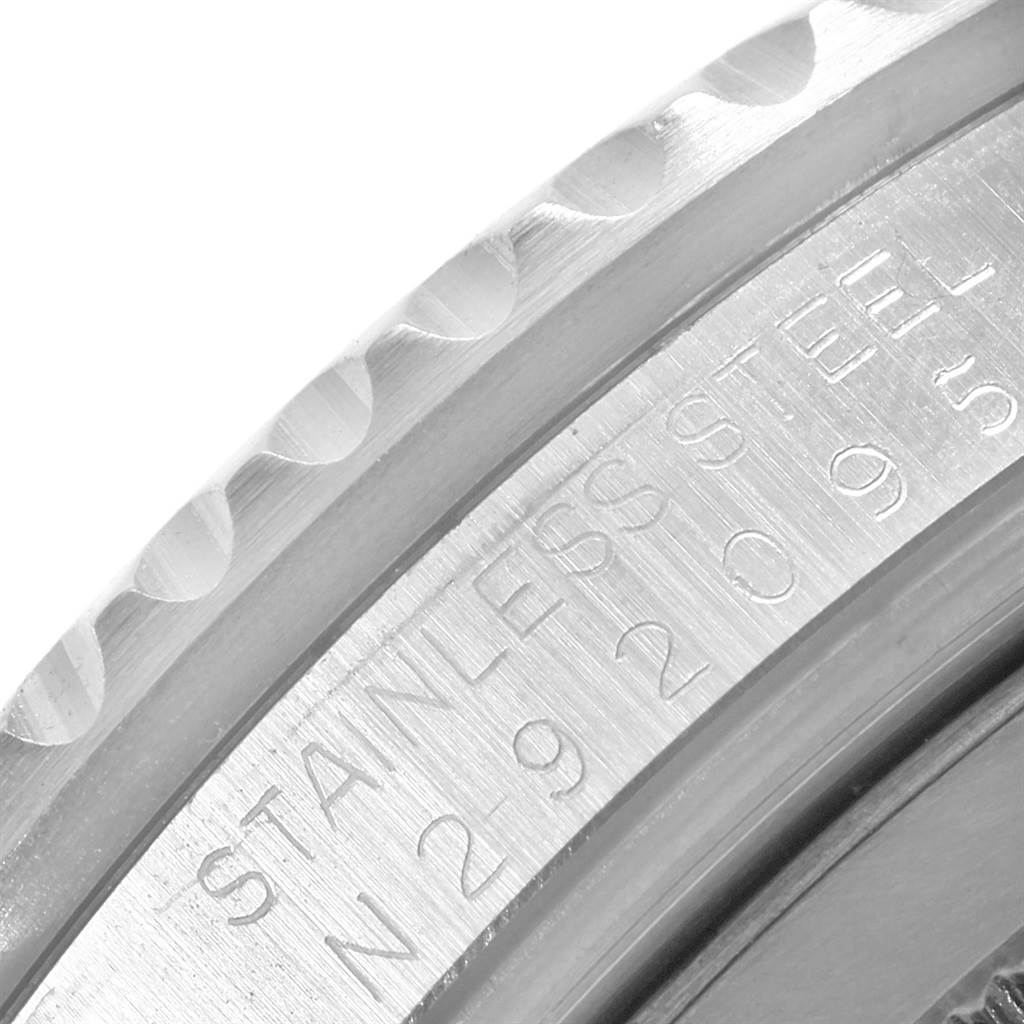 This close-up image shows the engraved inner bezel of a Rolex GMT-Master 16710 Men's Stainless Steel Black Dial 16710 Men's Stainless Steel Black Dial watch, highlighting the "STAINLESS" lettering.