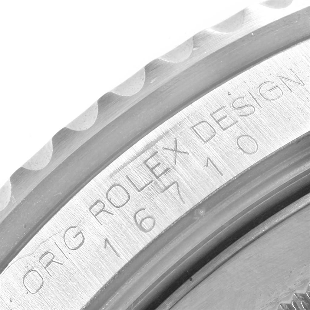 This close-up image shows the engraved stainless steel bezel and case side of a Rolex GMT-Master 16710 Men's Stainless Steel Black Dial 16710 Men's Stainless Steel Black Dial watch.