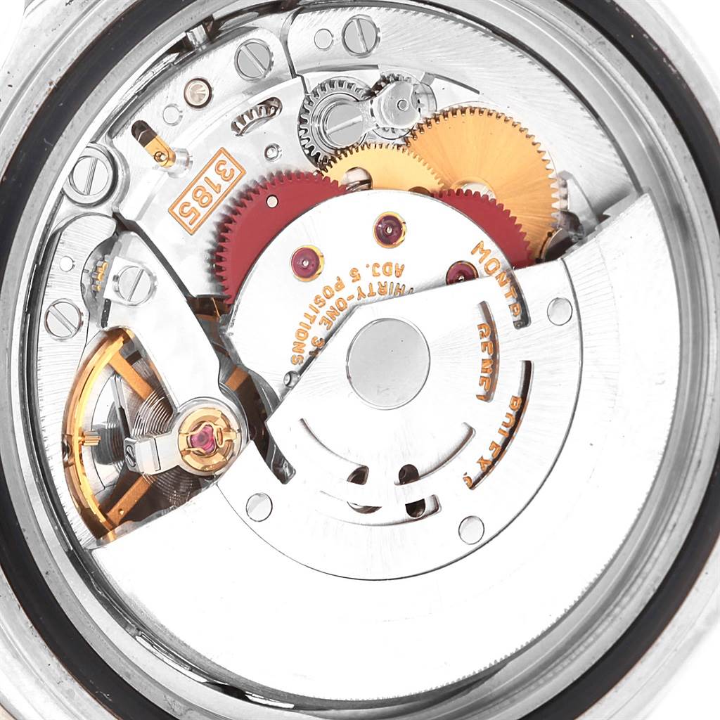 This is a close-up view of the Rolex GMT-Master 16710 Men's Stainless Steel Black Dial 16710 Men's Stainless Steel Black Dial movement, showing gears and mechanical components.