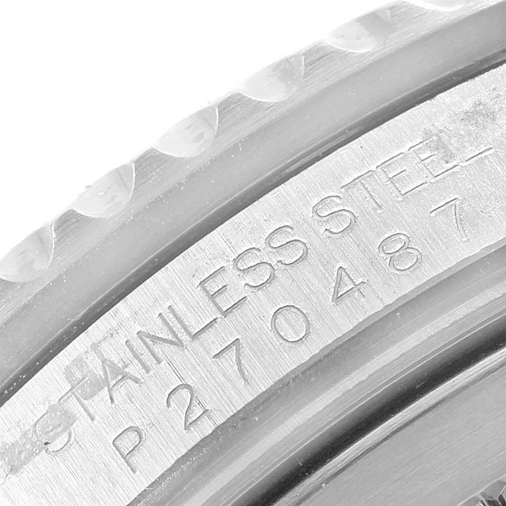 This close-up image shows the engraved edge of the Rolex GMT-Master 16710 Men's Stainless Steel Black Dial 16710 Men's Stainless Steel Black Dial watch's stainless steel casing.