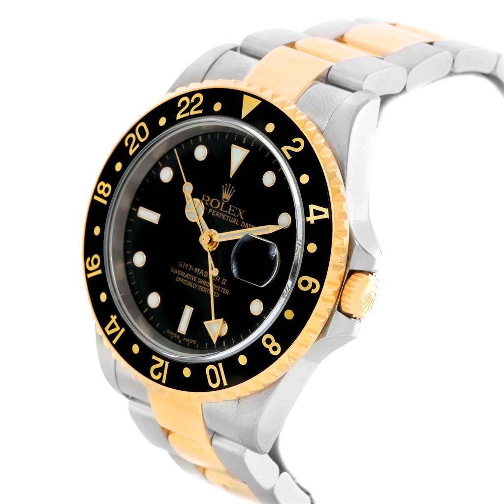 The Rolex GMT-Master 16713 Men
s Stainless Steel Black Dial 16713 Men
s Stainless Steel Black Dial watch is shown from a three-quarter angle, highlighting the bezel, dial, crown, and two-tone bracelet.