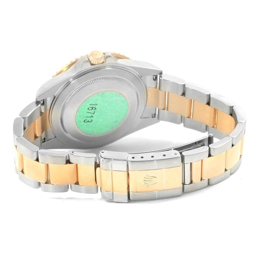 This image shows the back case, crown, and bracelet of a Rolex GMT-Master 16713 Men
s Stainless Steel Black Dial 16713 Men
s Stainless Steel Black Dial watch, model 16713.