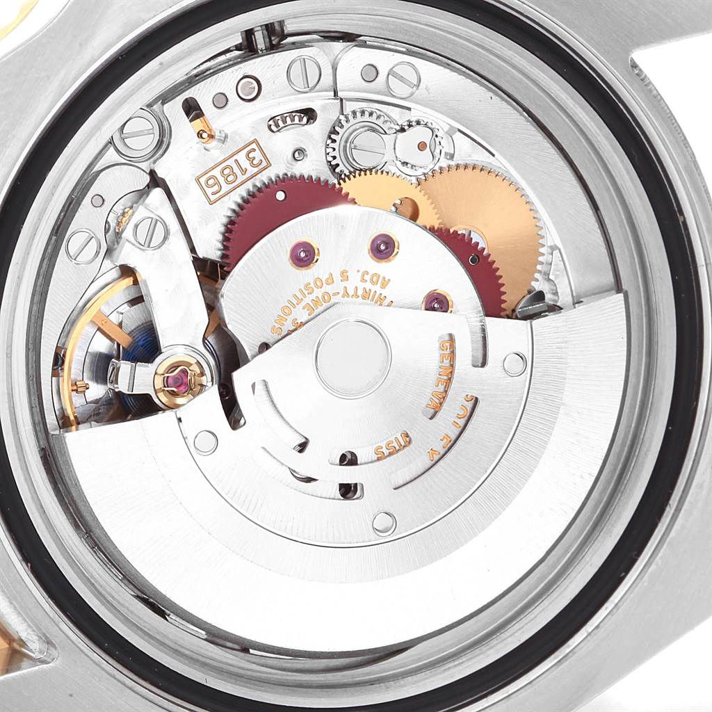 This is a close-up view of the movement and internal mechanics of a Rolex GMT-Master 116713 Men's Stainless Steel Black Dial 116713 Men's Stainless Steel Black Dial watch.