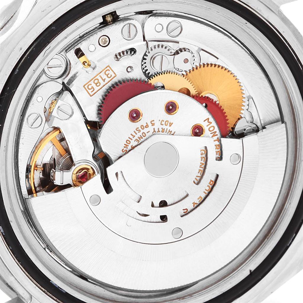 The image shows a close-up view of the movement and intricate components of a Rolex GMT-Master 16710 Men's Stainless Steel Black Dial 16710 Men's Stainless Steel Black Dial watch.