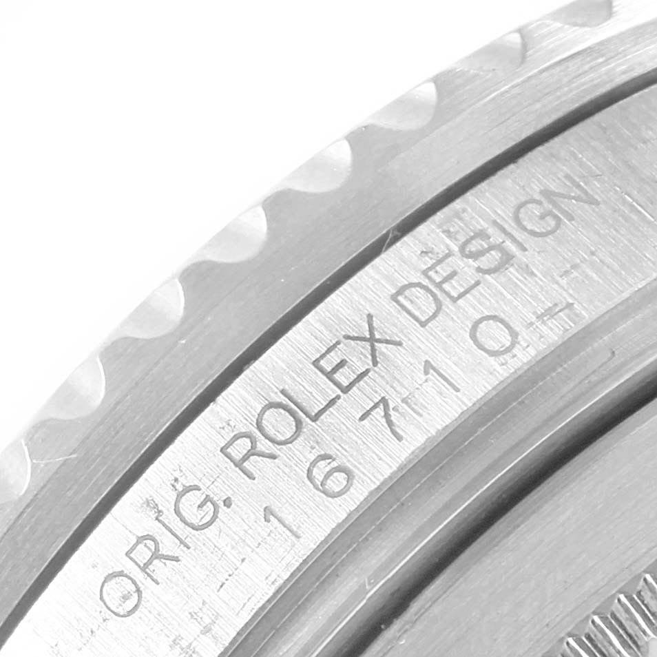 Close-up view of the side of a Rolex GMT-Master 16710 Men's Stainless Steel Black Dial 16710 Men's Stainless Steel Black Dial, showing the model number and design engraving.