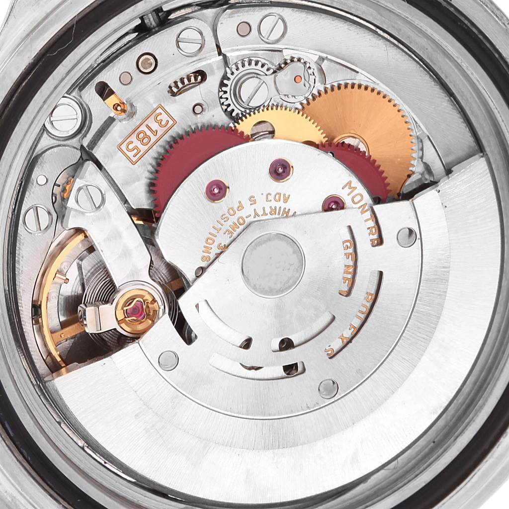 This close-up image shows the movement mechanism inside the Rolex GMT-Master 16710 Men's Stainless Steel Black Dial 16710 Men's Stainless Steel Black Dial watch, highlighting gears and intricate components.