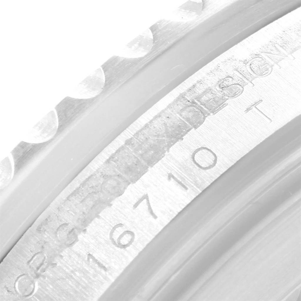 The image shows a close-up of the bezel and engraved serial/model number of the Rolex GMT-Master 16710 Men's Stainless Steel Black Dial 16710 Men's Stainless Steel Black Dial watch.