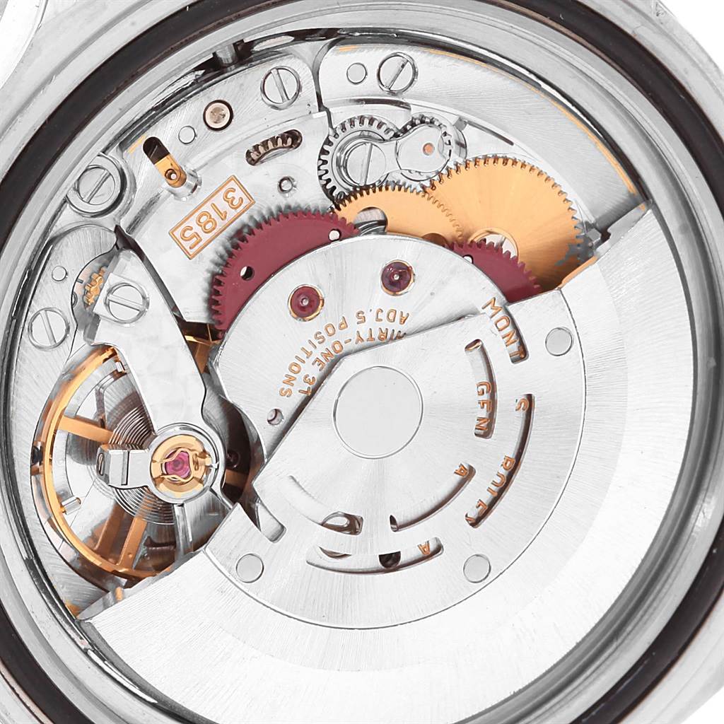 This image shows the inner mechanism of a Rolex GMT-Master 16710 Men's Stainless Steel Black Dial 16710 Men's Stainless Steel Black Dial watch, including gears and the rotor, viewed from the back.