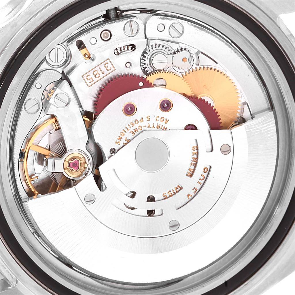 This image shows the internal movement of the Rolex GMT-Master 16710 Men
s Stainless Steel Black Dial 16710 Men
s Stainless Steel Black Dial watch, primarily focusing on its gears and mechanisms from a top-down angle.