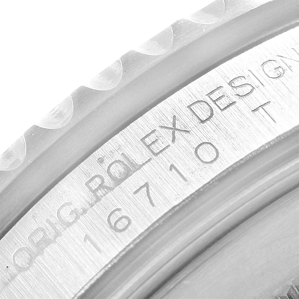 This close-up image shows the engraved model number and brand name on the case of the Rolex GMT-Master 16710 Men
s Stainless Steel Black Dial 16710 Men
s Stainless Steel Black Dial.