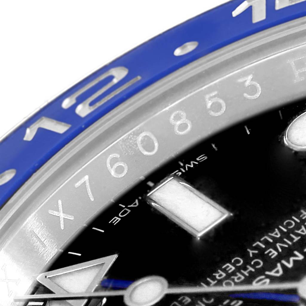 This close-up image of a Rolex GMT-Master 116710 Men
s Stainless Steel Black Dial 116710 Men
s Stainless Steel Black Dial watch shows a portion of the blue bezel, hour markers, and part of the chapter ring.