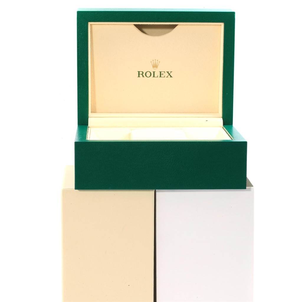 The image shows an open Rolex box from the front, likely for a GMT-Master watch, with the brand name visible inside.