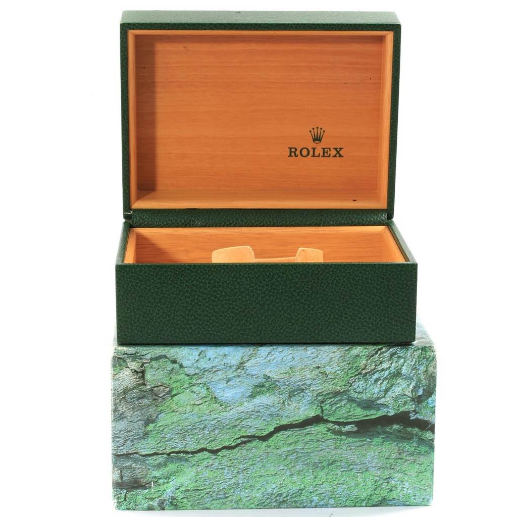 The image shows an open green and wooden Rolex GMT-Master 16700 Men's Stainless Steel Black Dial 16700 Men's Stainless Steel Black Dial watch box with the Rolex logo inside the lid.