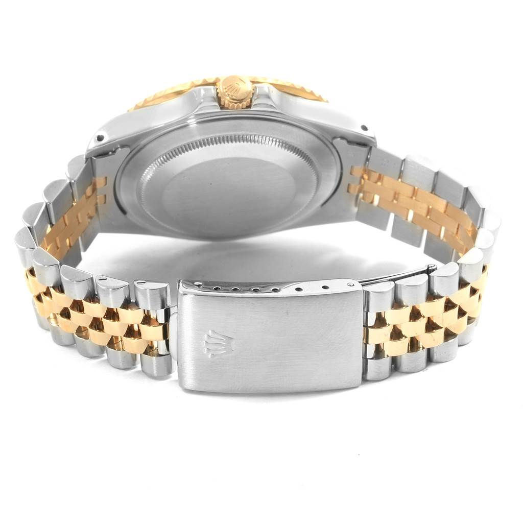 This image shows the back case and two-tone jubilee bracelet of a Rolex GMT-Master 16713 Men's Stainless Steel Black Dial 16713 Men's Stainless Steel Black Dial watch.