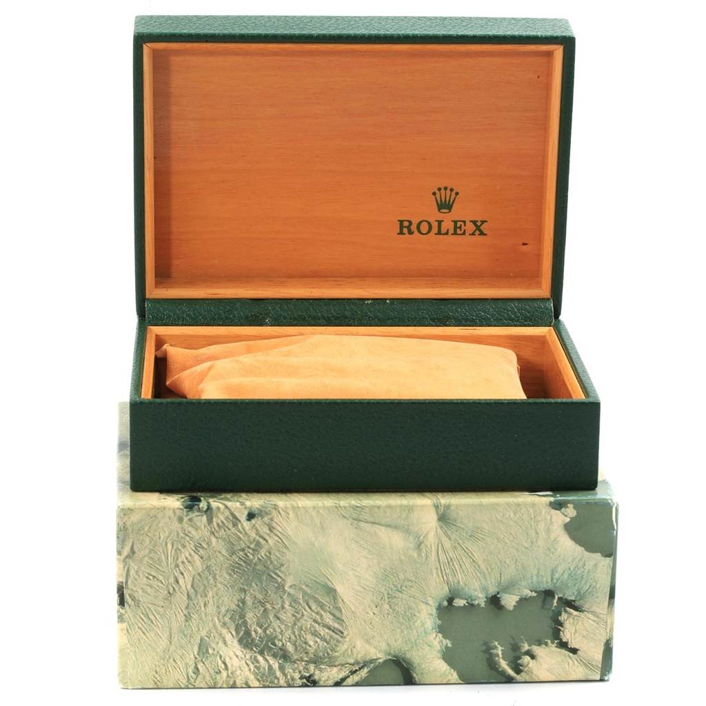 This image shows a green Rolex GMT-Master 16700 Men's Stainless Steel Black Dial 16700 Men's Stainless Steel Black Dial watch box with the lid open, revealing a beige cushion inside.