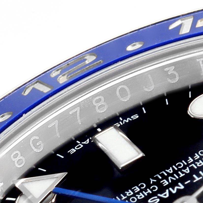 The image shows a close-up of the dial, bezel, and part of the hand of a Rolex GMT-Master 116710 Men's Stainless Steel Black Dial 116710 Men's Stainless Steel Black Dial watch.