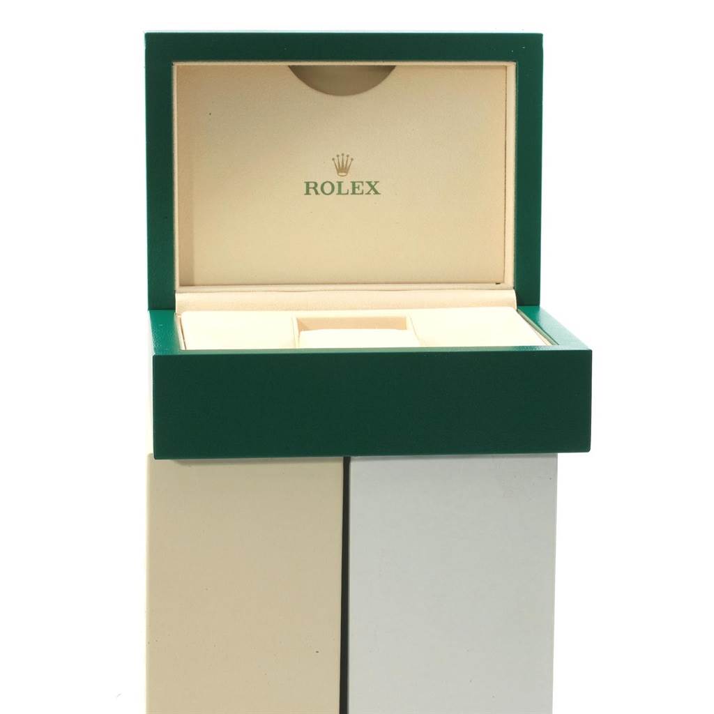 The image shows an open Rolex watch box for the GMT-Master model, displaying only the empty interior and green exterior.