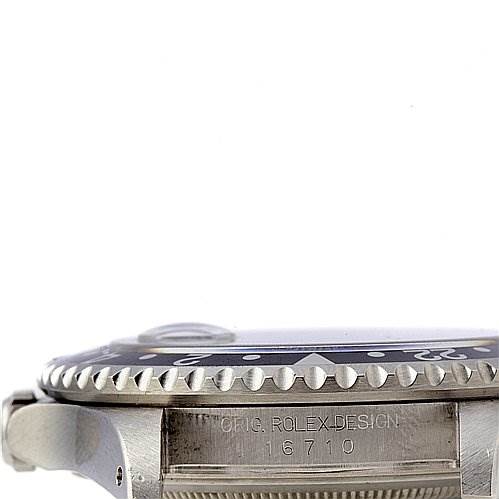 This image shows a side angle of a Rolex GMT-Master 16710 Men's Stainless Steel Black Dial 16710 Men's Stainless Steel Black Dial watch, highlighting the bezel, case, and the model number 16710.