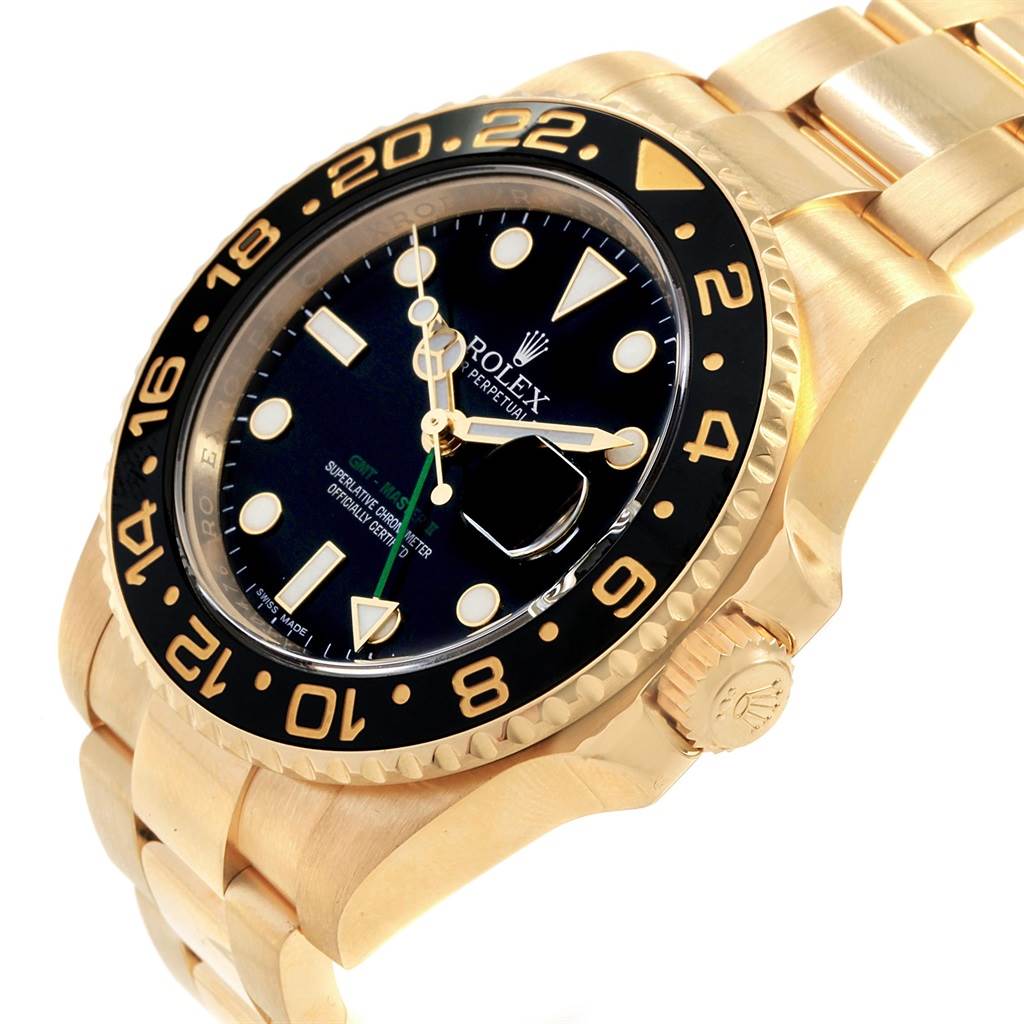 The image shows a Rolex GMT-Master 116718 Men
s Yellow Gold Black Dial 116718 Men
s Yellow Gold Black Dial watch at an angled view, highlighting its gold case, bezel, black dial, and oyster bracelet.