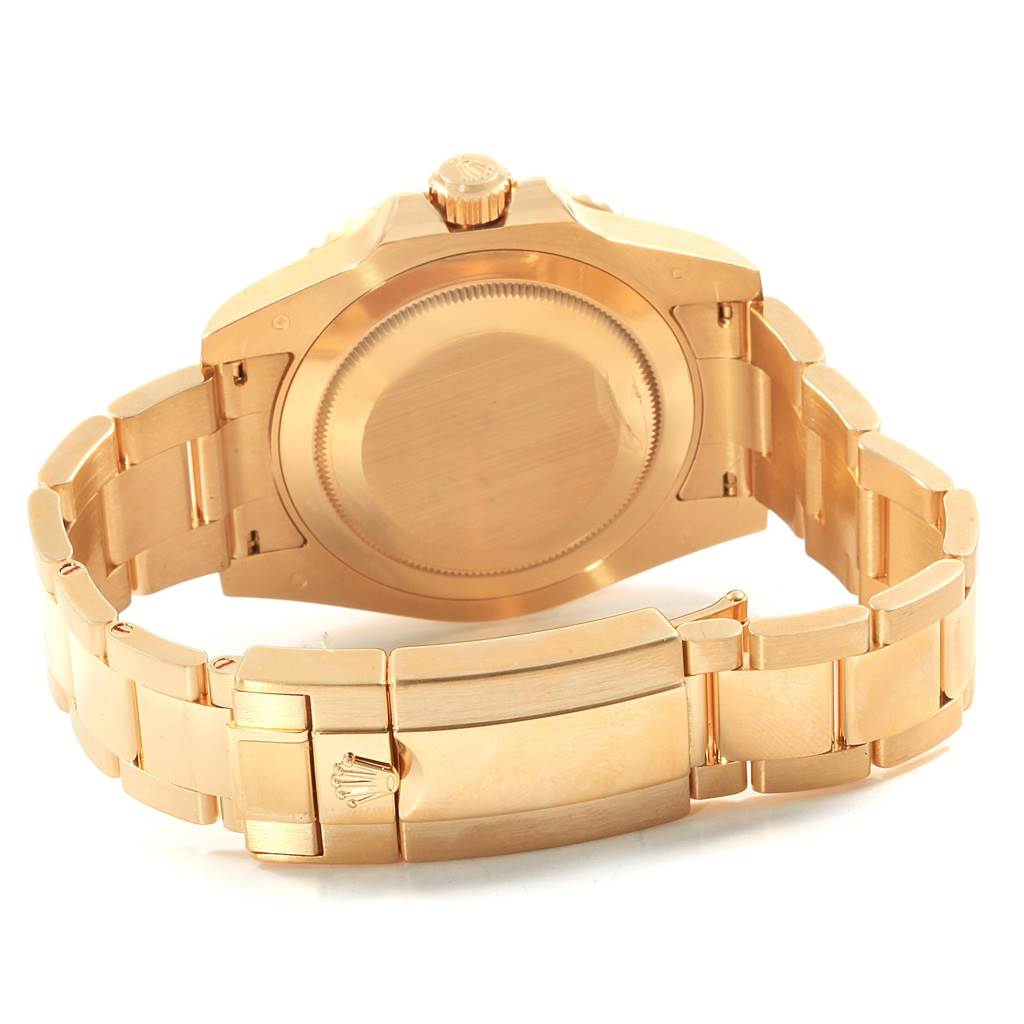 The image shows the back and clasp of a Rolex GMT-Master 116718 Men
s Yellow Gold Black Dial 116718 Men
s Yellow Gold Black Dial watch, highlighting its case and bracelet.