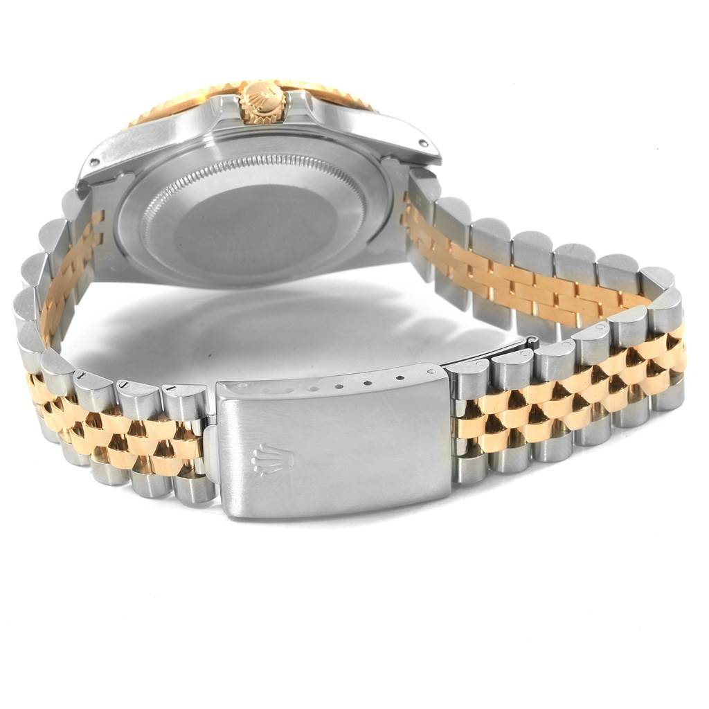 This image shows the back view of a Rolex GMT-Master 16713 Men's Stainless Steel Grey Dial 16713 Men's Stainless Steel Grey Dial watch, featuring its clasp, caseback, and two-tone bracelet.