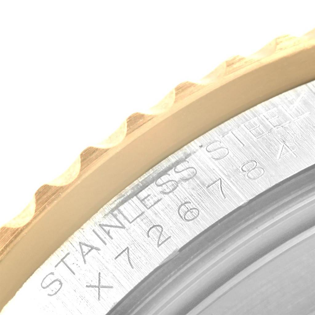 The image shows a close-up of the bezel and serial number engraving on a Rolex GMT-Master 16713 Men's Stainless Steel Grey Dial 16713 Men's Stainless Steel Grey Dial watch.
