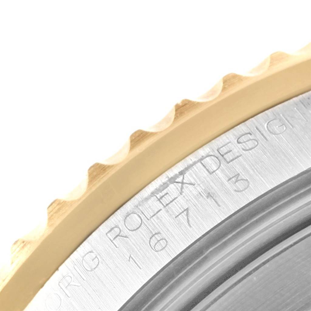 This image shows a close-up of the side bezel and engraving on the case back of a Rolex GMT-Master 16713 Men's Stainless Steel Grey Dial 16713 Men's Stainless Steel Grey Dial.
