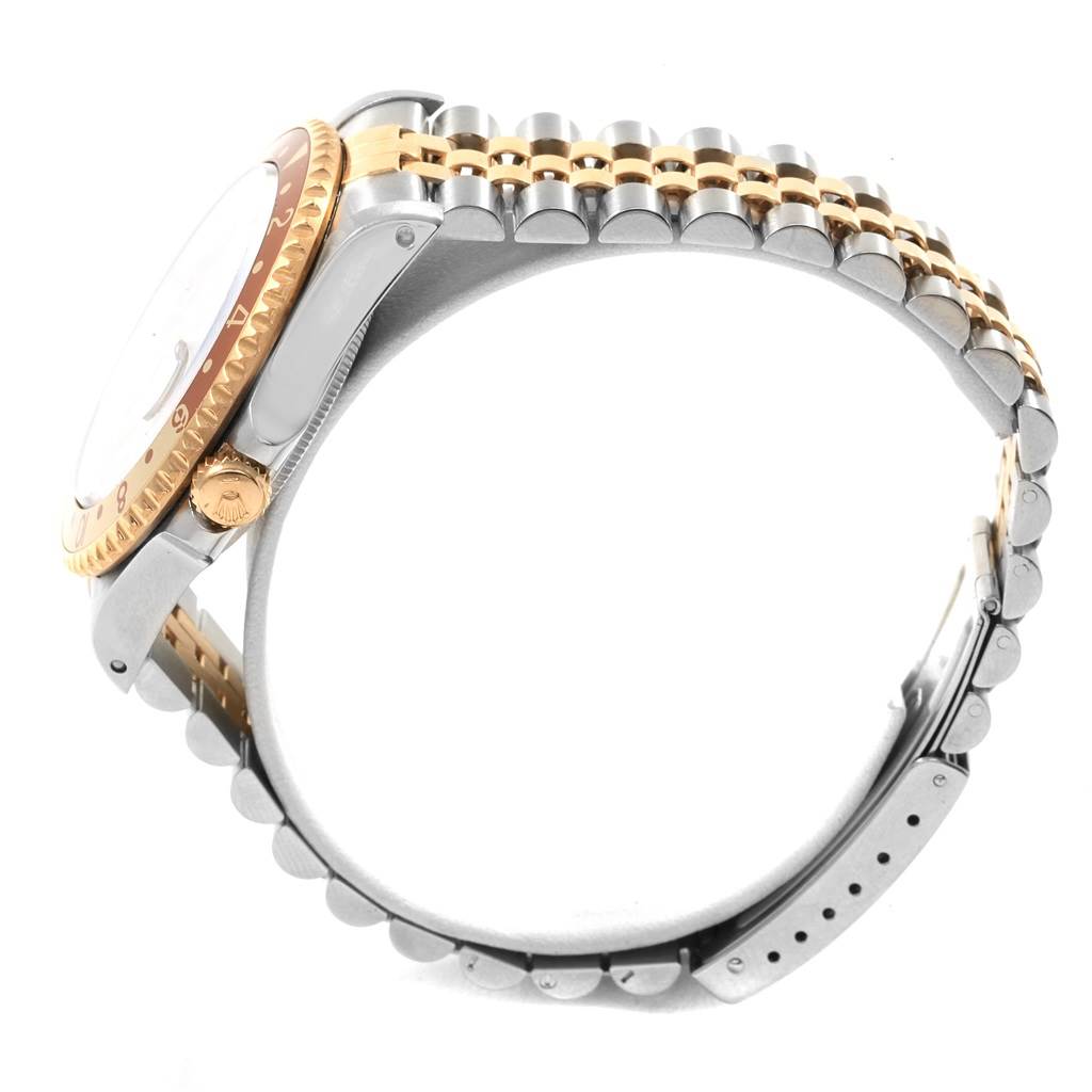 The image shows a side angle of the Rolex GMT-Master 16713 Men's Stainless Steel Grey Dial 16713 Men's Stainless Steel Grey Dial watch with a focus on the bezel, crown, and part of the strap.