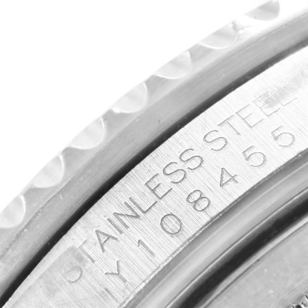 The image shows a close-up of the brushed stainless steel case with engraved serial number of a Rolex GMT-Master 16710 Men's Stainless Steel Black Dial 16710 Men's Stainless Steel Black Dial watch.