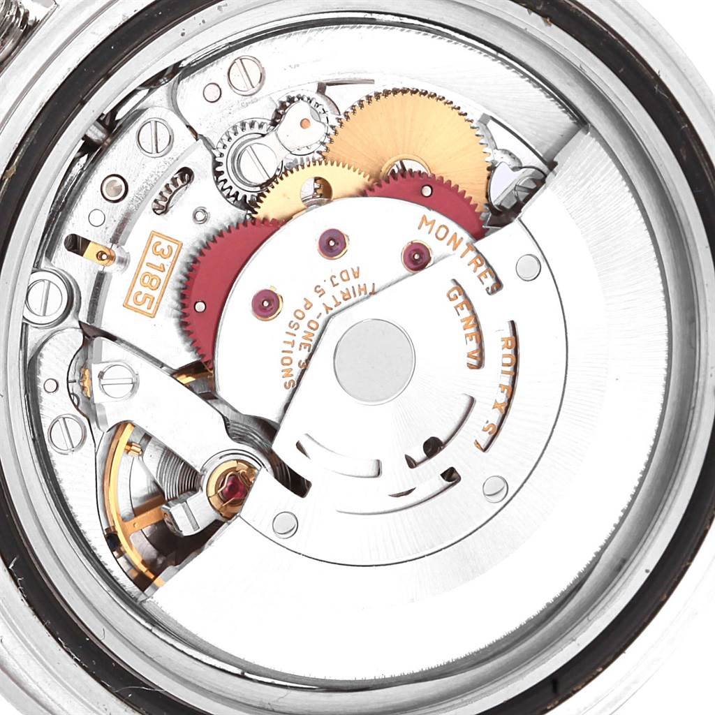 The image shows a close-up view of the internal mechanical movement of a Rolex GMT-Master 16710 Men's Stainless Steel Black Dial 16710 Men's Stainless Steel Black Dial watch, highlighting gears and components.